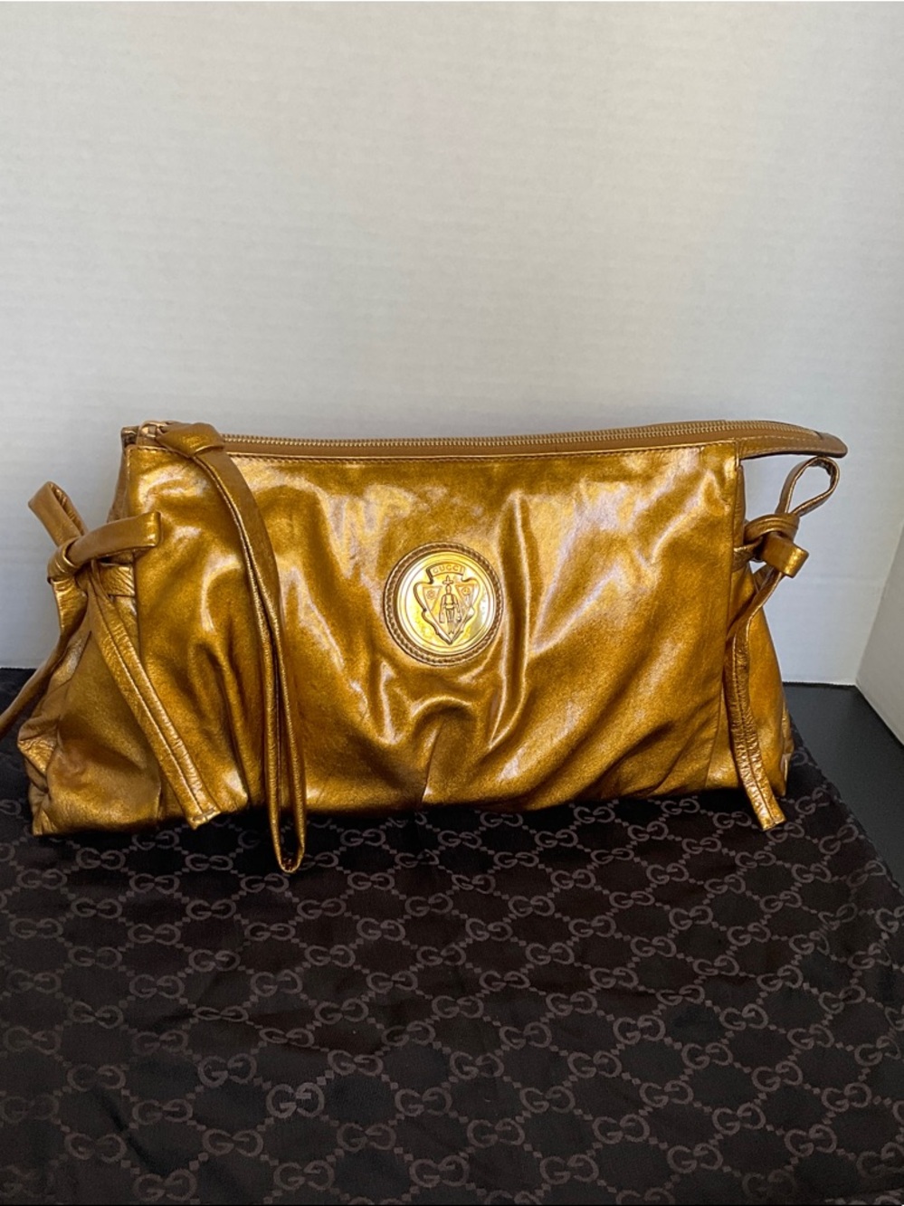 Gucci Metallic Gold Leather Wristlet Clutch with Medallion